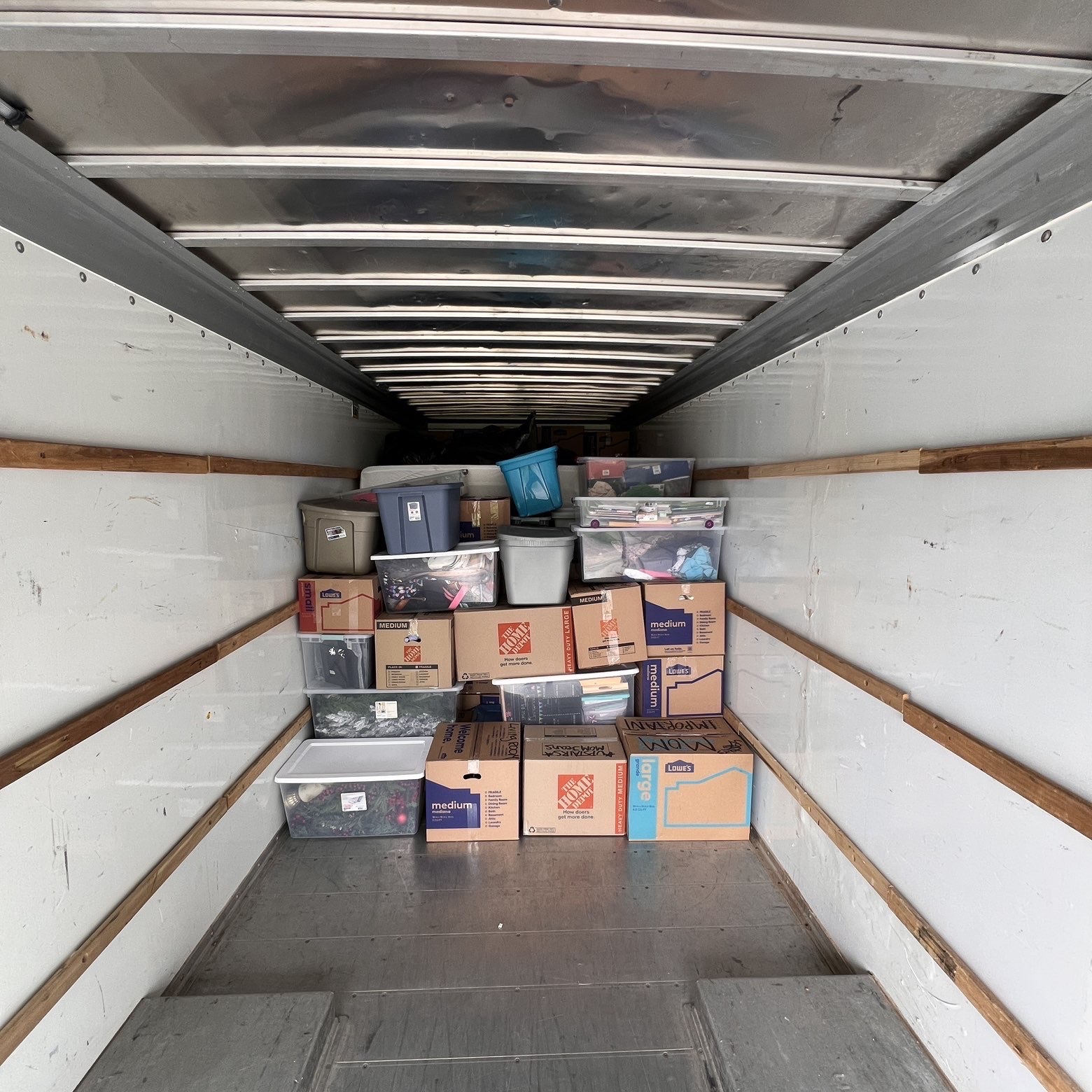 Carefully stacked boxes inside the moving truck