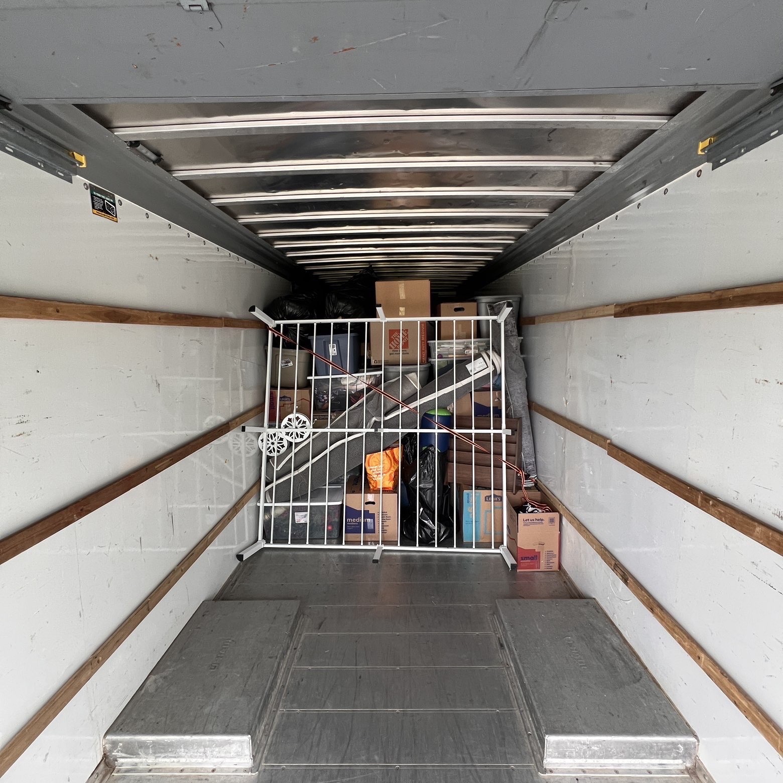 Truck loaded floor to ceiling, gated for safety